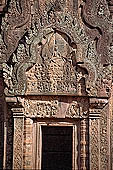 Banteay Srei temple - southern library west pediment, Kama aiming an arrow to Shiva